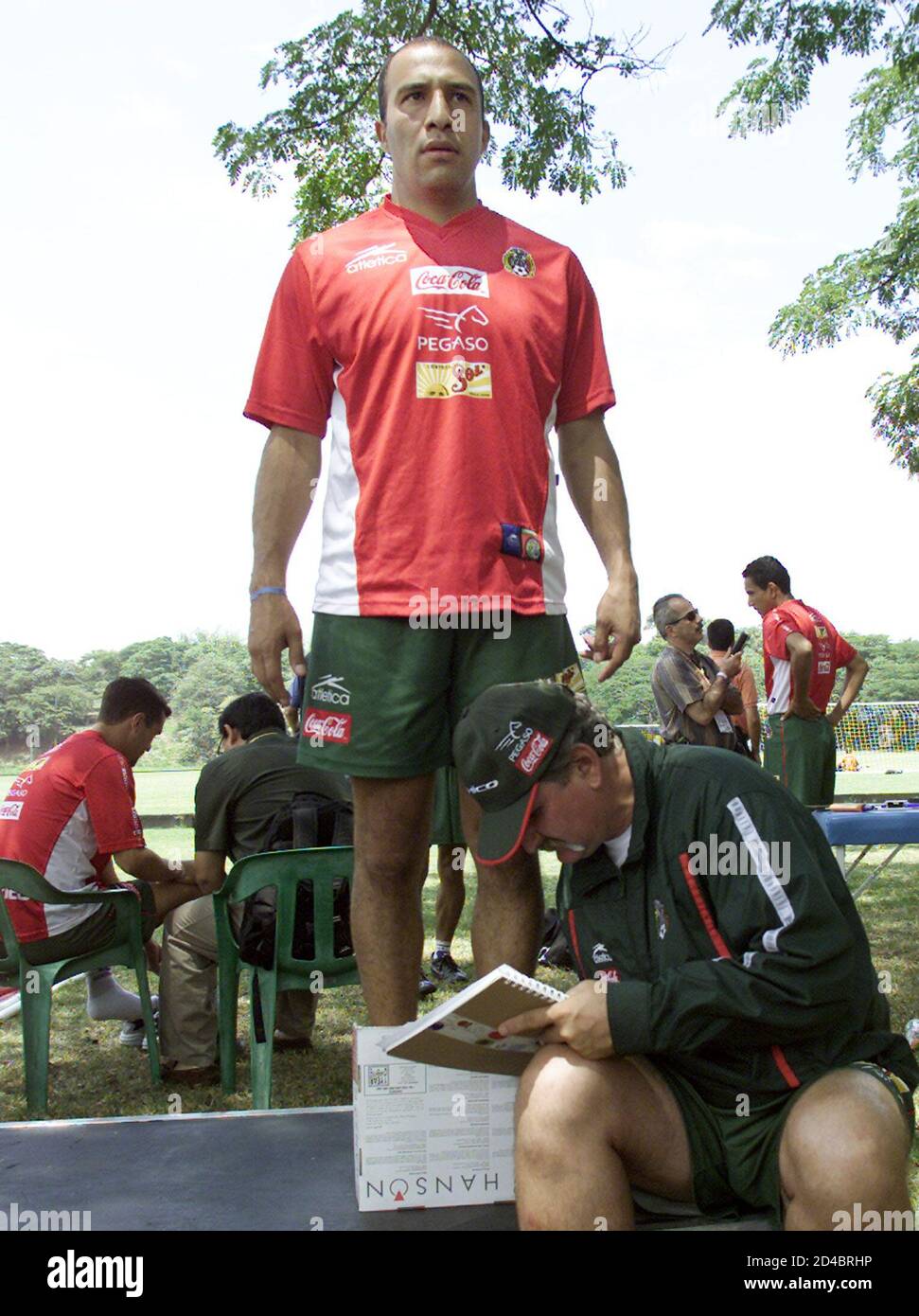 Mexico's starting goalie, Oscar Perez, is weighed by team doctor, Radames Gaxiola, at the Campestre Club in Cali where the team is staying during the Copa America, July 13, 2001. Mexico upset Brazil in their first match of the tournament and plays Paraguay on July 15.  RR Stock Photo
