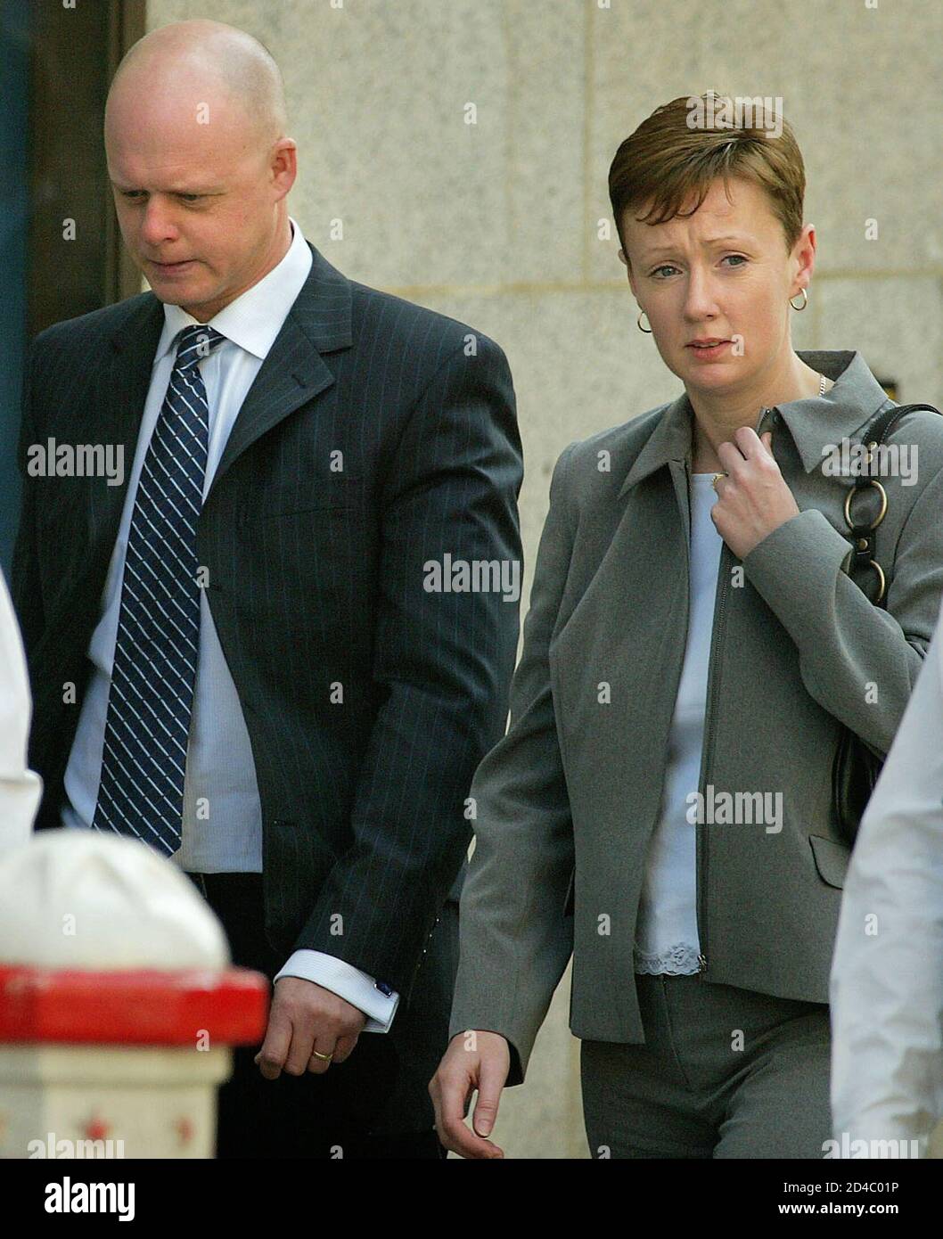 Parents of murdered Soham schoolgirl Holly Wells, (L-R) Kevin and Nicola, leave the Old Bailey in London, April 16, 2003. Former school caretaker Ian Huntley on Wednesday denied killing two schoolgirls Holly Wells and Jessica Chapman from Soham in Cambridgeshire, Britain in August 2002, in a double murder which shocked the country and sparked calls for a return of the death penalty. Huntley's girlfriend at the time of the deaths, former teaching assistant Maxine Carr, denied two charges of helping an offender and a charge of perverting the course of justice. REUTERS/Peter Macdiarmid  PKM/ASA Stock Photo