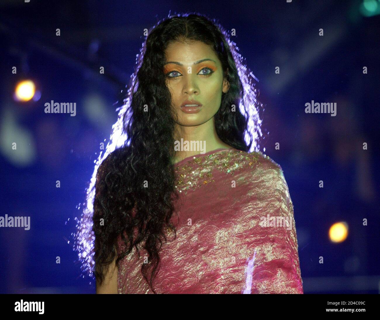 A model wears an Indian sari by Indian designer Satya Paul during a midnight fashion show in the eastern Indian city of Calcutta,early on May 17, 2003. Satya Paul's collection was inspired A model wears an Indian sari by Indian designer Satya Paul during a midnight fashion show in the eastern Indian city of Calcutta,early on May 17, 2003. Satya Paul's collection was inspired