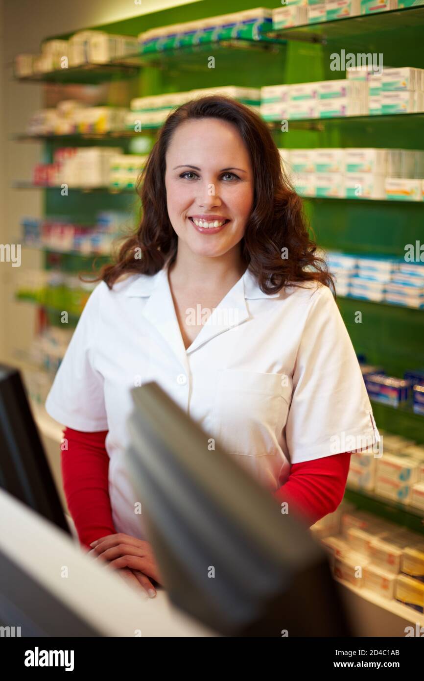Pharmacist stands behind counter hi-res stock photography and images ...