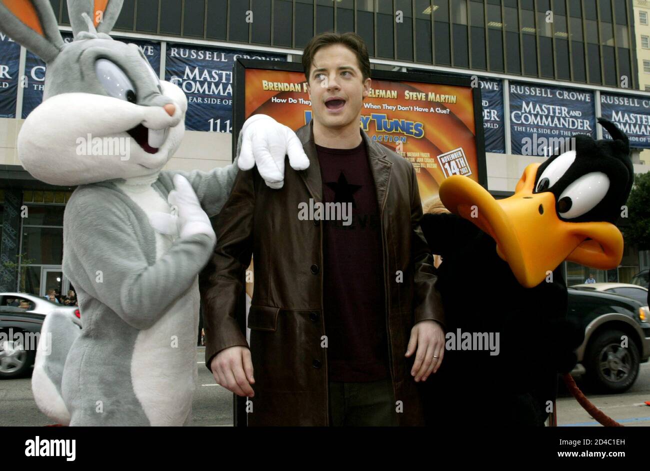 Actor Brendan Fraser (C), one of the cast members of the new comedy film "Looney  Tunes Back in Action," is greeted by Bugs Bunny (L) and Daffy Duck at the  film's premiere