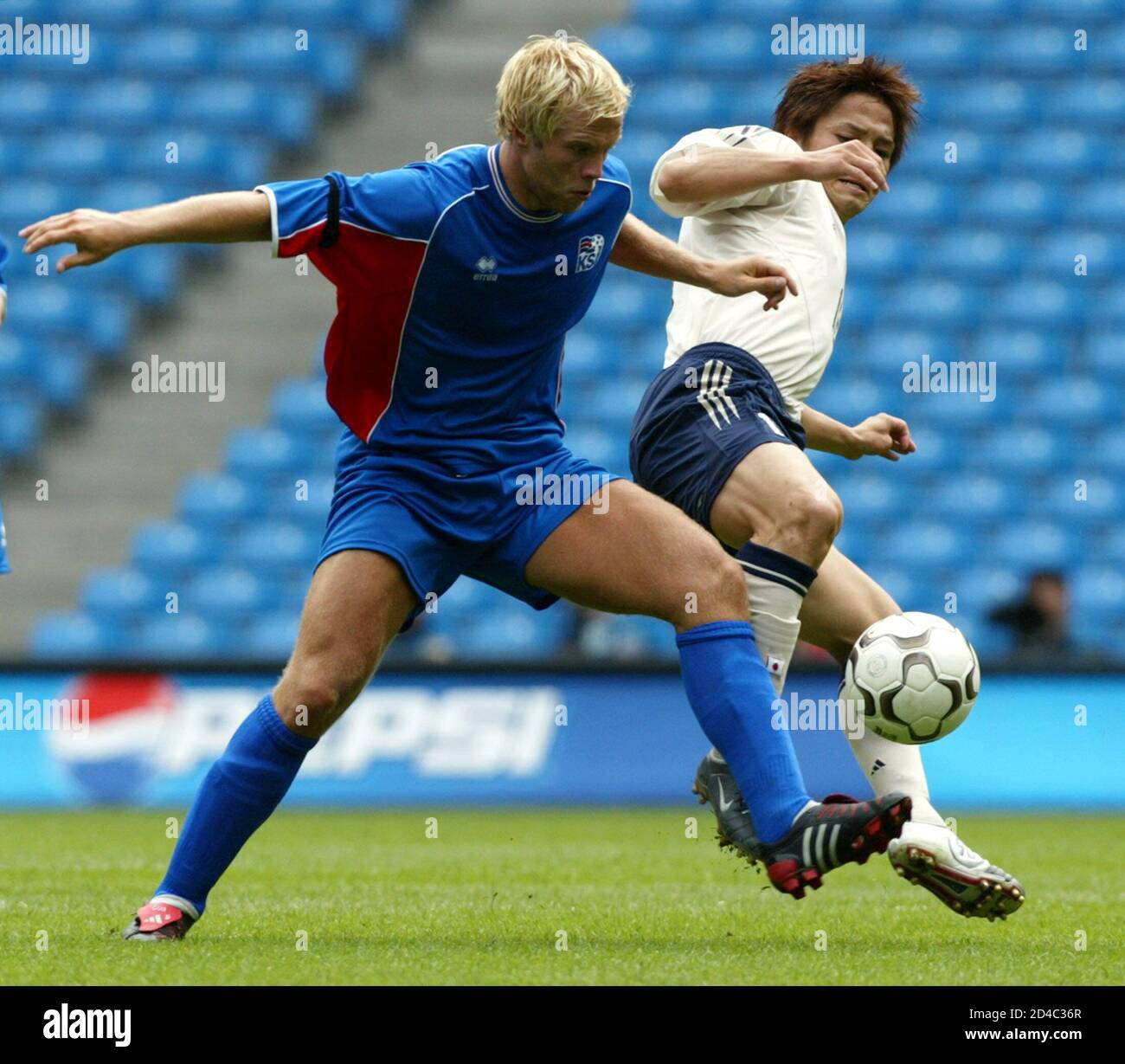 Iceland S Gudjohnsen Struggles For The Ball Against Japan S Inamoto During Their Three Nation Tournament Soccer Match In Manchester Iceland S Eidur Gudjohnsen Struggles For The Ball Against Japan S Junichi Inamoto R During Their Three Nation