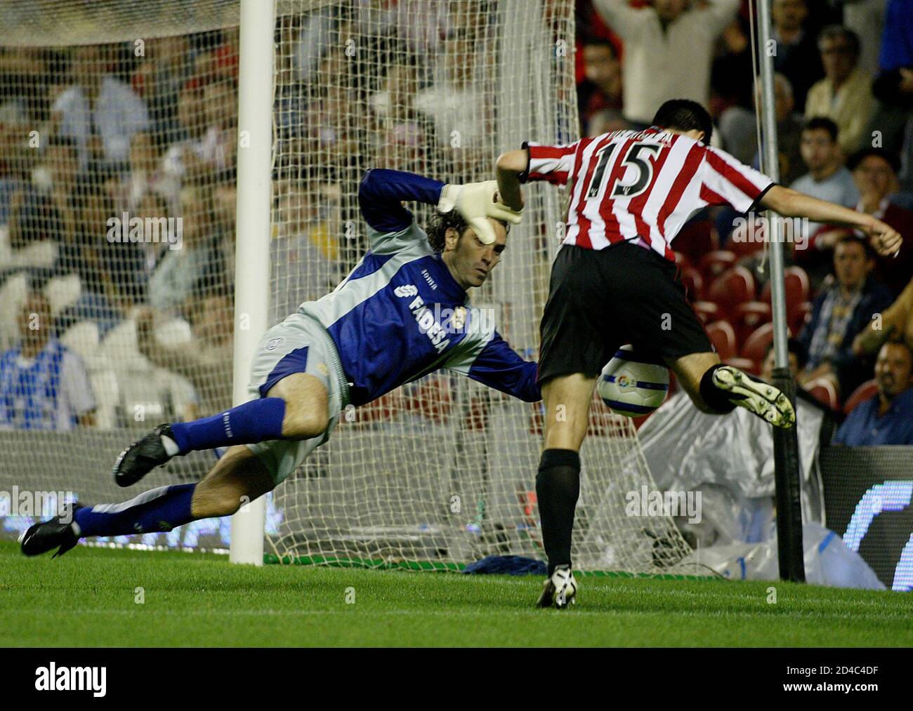 Deportivo Coruna's goalkeeper Jose Francisco Molina stops a shot at the  goal by Athletic Bilbao's Andoni Iraola in Bilbao. Deportivo Coruna's  goalkeeper Jose Francisco Molina stops a shot at the goal by