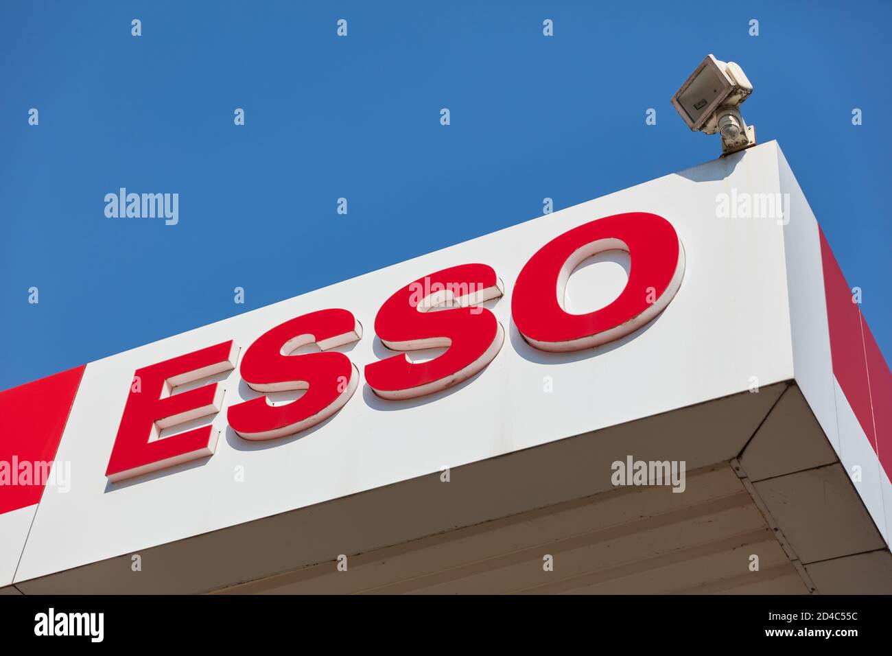 COLOGNE; May 2020: Logo of Esso gas station in Germany in front of blue sky Stock Photo