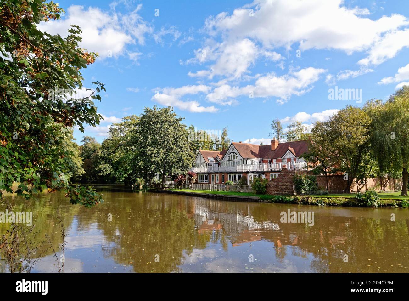 Exclusive private properties on a quiet backwater of the River Wey Navigation canal, Weybridge Surrey England UK Stock Photo