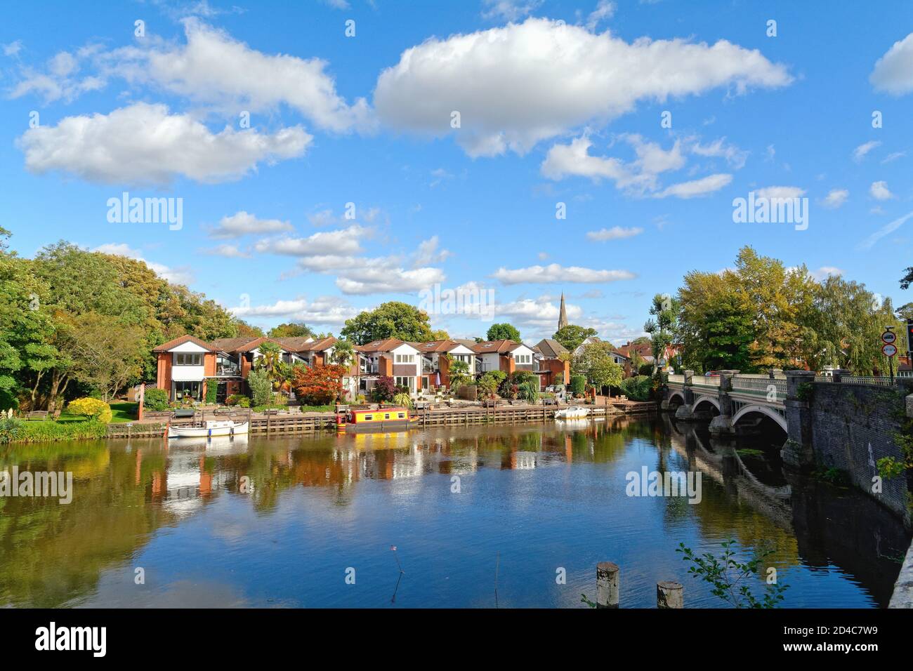 Modern houses on the waterside on the River Wey Navigation canal at Weybridge Surrey England UK Stock Photo