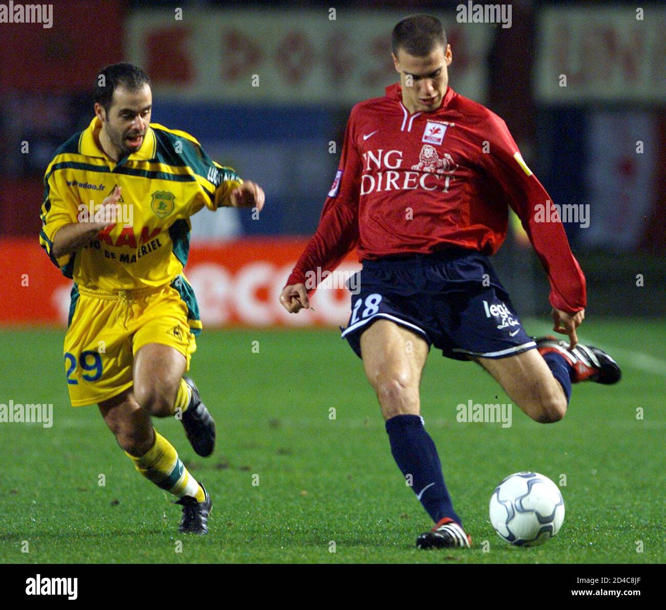 Bruno Cheyrou (R) of Lille controls the ball against Stephane Ziani (L) of  Nantes during early action in their French championship soccer match at the  Grimonprez Jooris stadium in Lille, February 7,