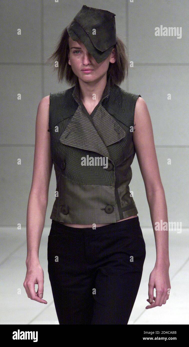 A Model For Japanese Designer Atsuro Tayama Presents This Sleeveless Double Breasted Jacket With A Matching Hat As Part Of His Spring Summer 02 Ready To Wear Collection In Paris October 11 01 Stock Photo