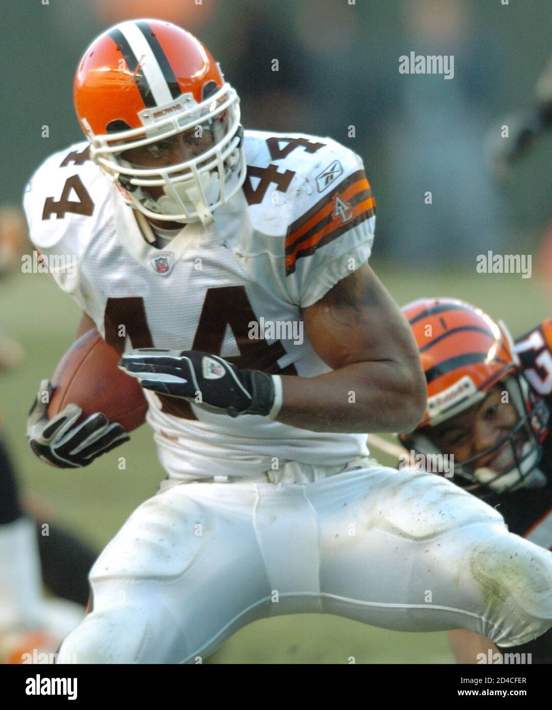 Cleveland Browns running back Lee Suggs (L) breaks free from Artrell  Hawkins of the Cincinnati Bengals to score a touchdown, during the fourth  quarter of NFL action at Paul Brown Stadium in