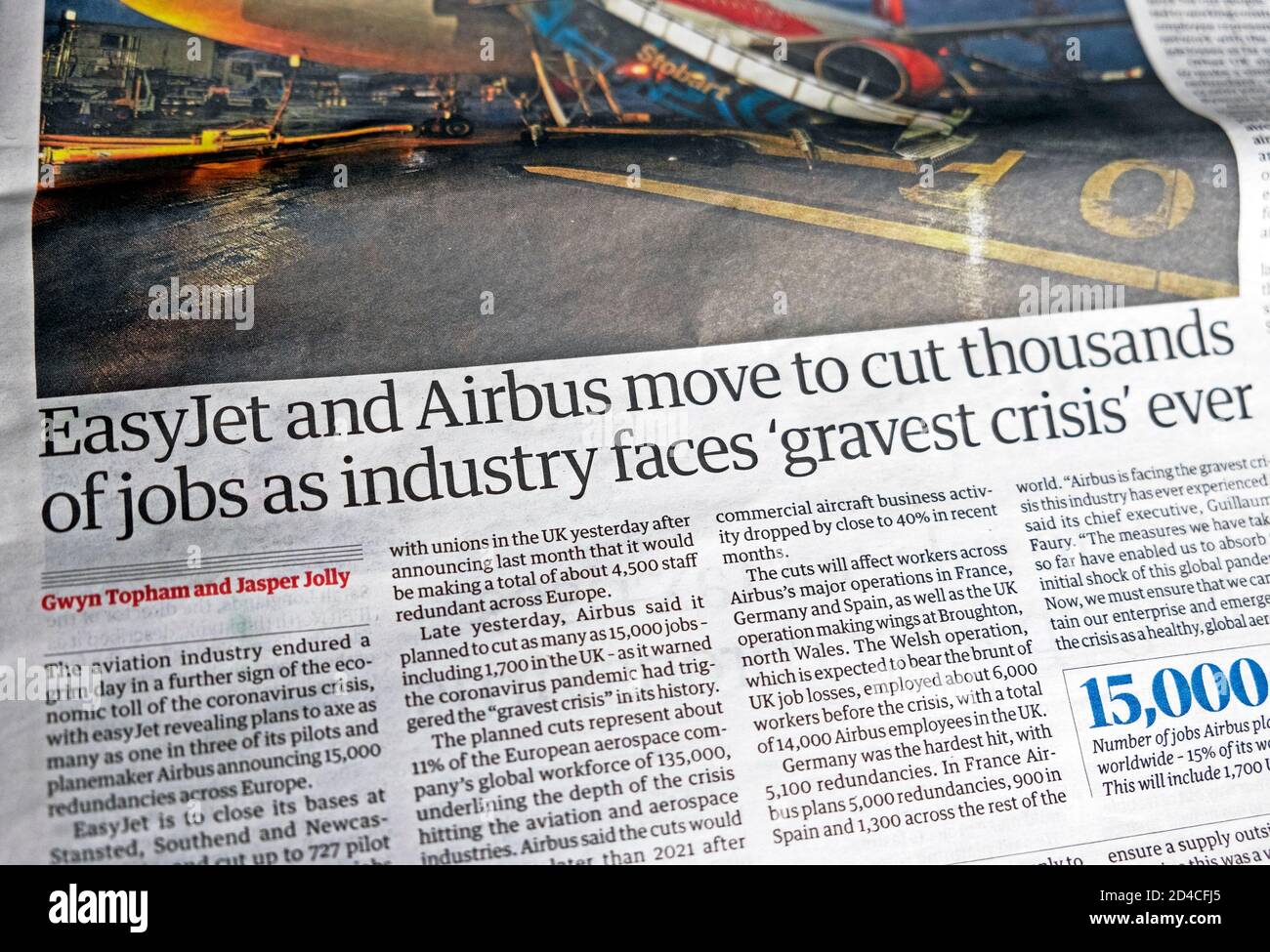 'EasyjJet and Airbus move to cut thousands of jobs as industry faces 'gravest crisis ever' newspaper headline inside Guardian paper London England UK Stock Photo