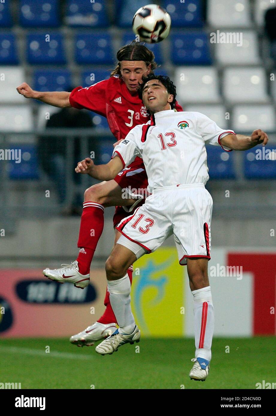 Syria's Jenyat and Canada's Ledgerwood jump for the ball during their World  Youth Championships match in Tilburg. Syria's Aatef Jenyat (R) and Canada's Nik  Ledgerwood jump for the ball during their Group