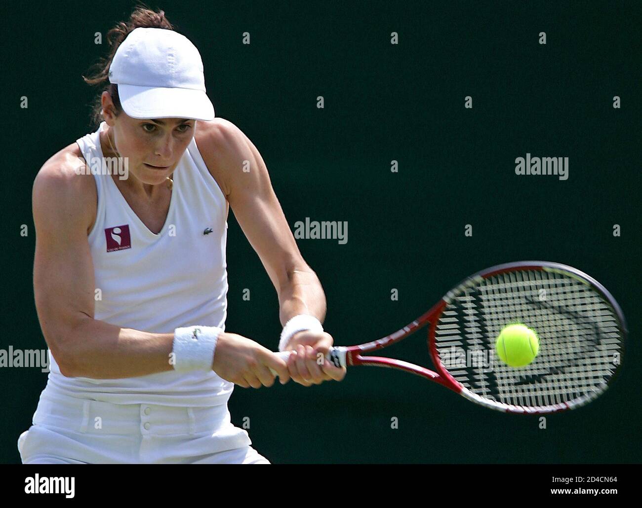 Nathalie Dechy of France returns the ball to Britain's Jane O'Donoghue in  their ladies' singles