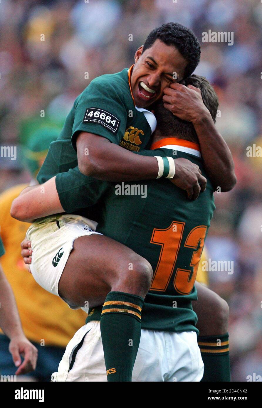 South Africa's Paulse celebrates with team mate Fourie after Fourie scored  during Nelson Mandela Rugby Challenge in Johannesburg. South Africa's  Breyton Paulse (L) celebrates with team mate Jaque Fourie (R) after Fourie