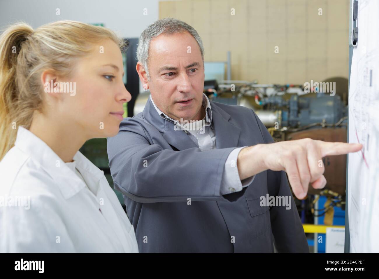 man and woman working in a robotics lab Stock Photo