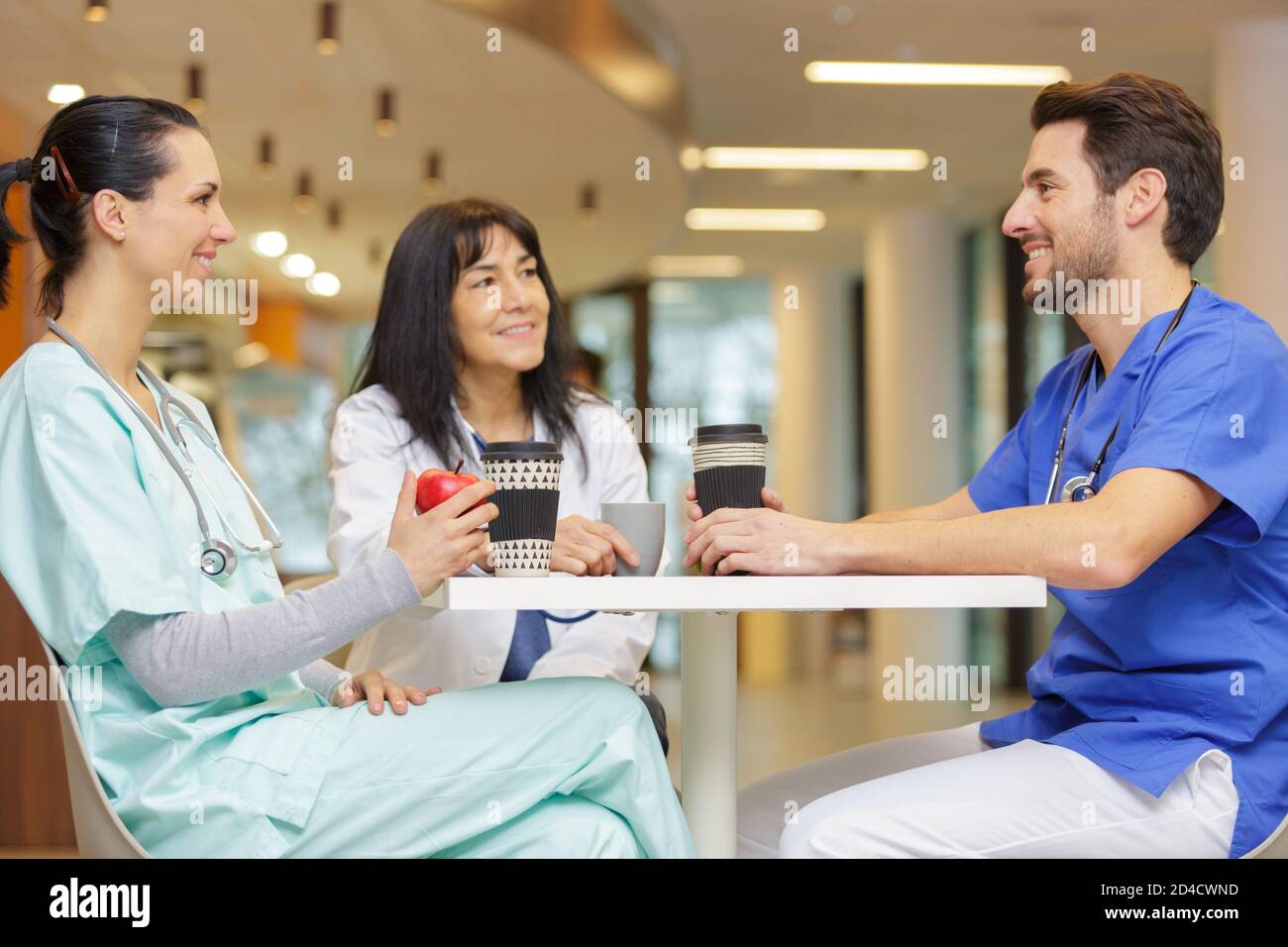 3 doctors having lunch break Stock Photo Alamy