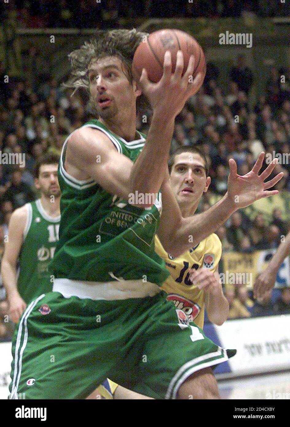 Denis Marconato from Benetton Treviso looks to pass in front of Tal  Burstein (R) from Maccabi Tel Aviv in Tel Aviv January 31, 2002. The match  is a Euroleague Group A match.