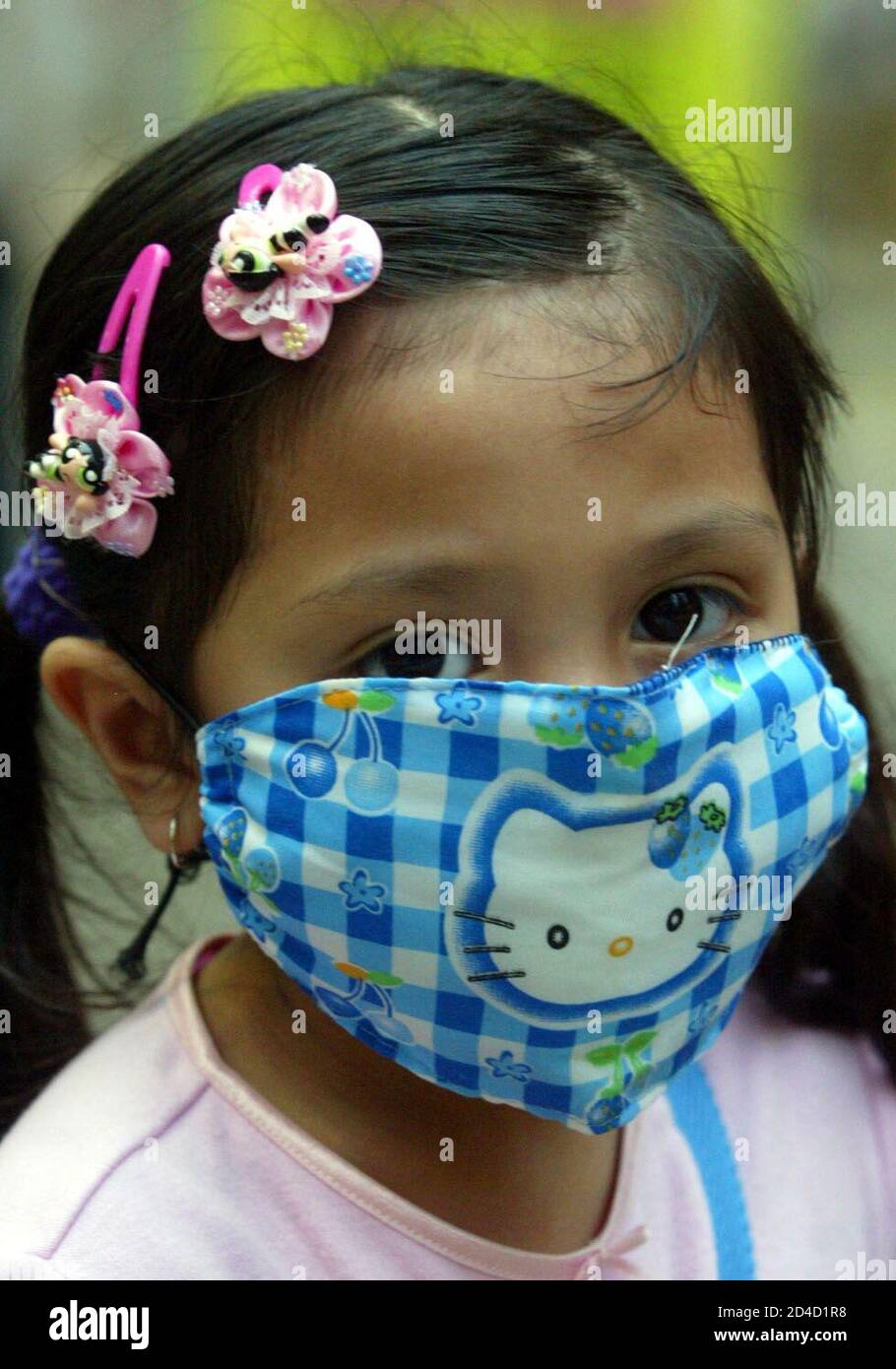 - PHOTO TAKEN 02APR03 - A girl wears a fashionable mask in Hong Kong to protect herself against the Severe Acute Respiratory Syndrome (SARS) April 2, 2003. Millions of residents in the territory wear masks on streets as the killer virus spread around. Stock Photo