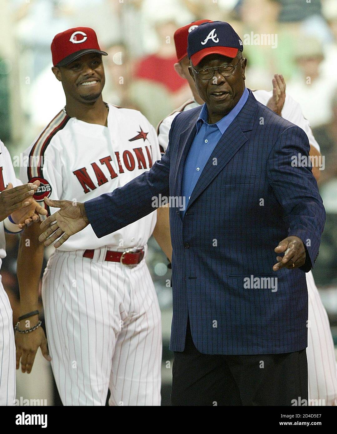Hank Aaron (R) walks by Cincinnati Reds Ken Griffey, Jr. at the  introduction for the MLB players with 500 or more career home runs before  the MLB All-Star Game Home Run Derby