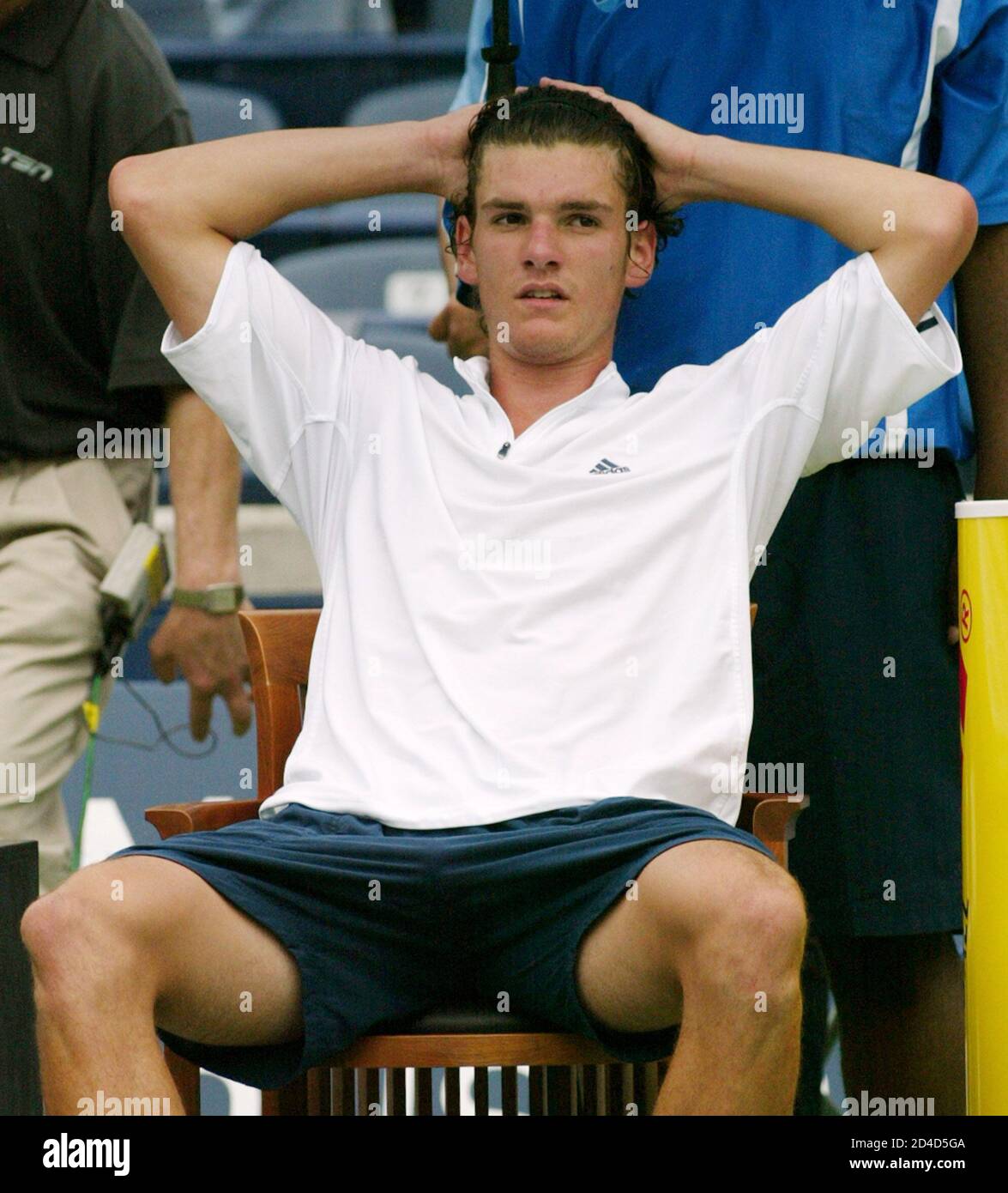 Canadian Frank Dancevic sits after losing to Vincent Sapdea of the United  States at the Tennis Masters Canada tournament in Toronto July 28, 2004.  Spadea defeated Dancevic 6-1 6-4. REUTERS/Andrew Wallace PJ