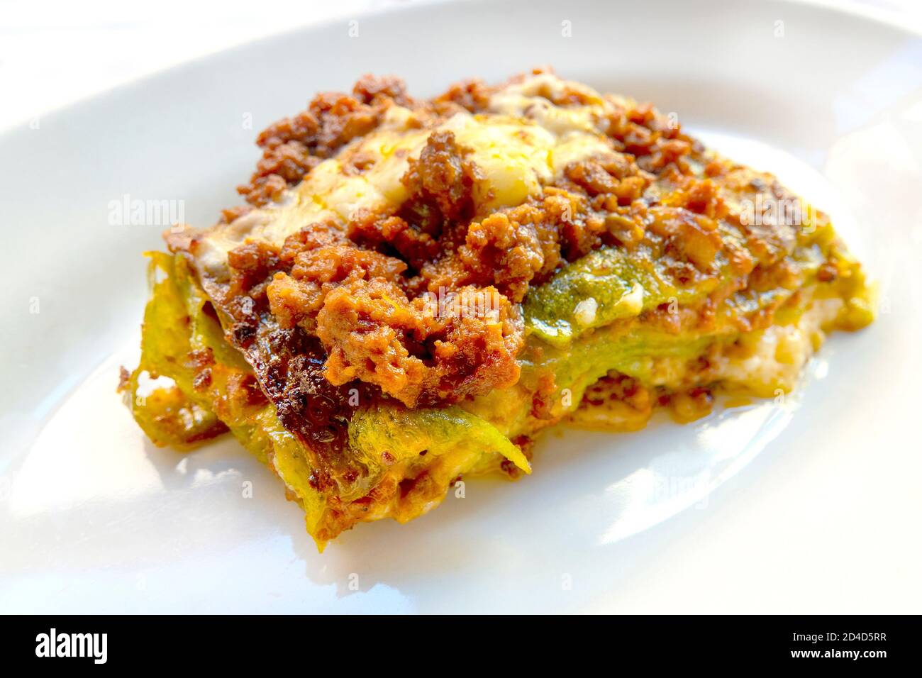 Green lasagne with ragù, Parmesan and bechamel, typical of the bolognese cuisine Stock Photo
