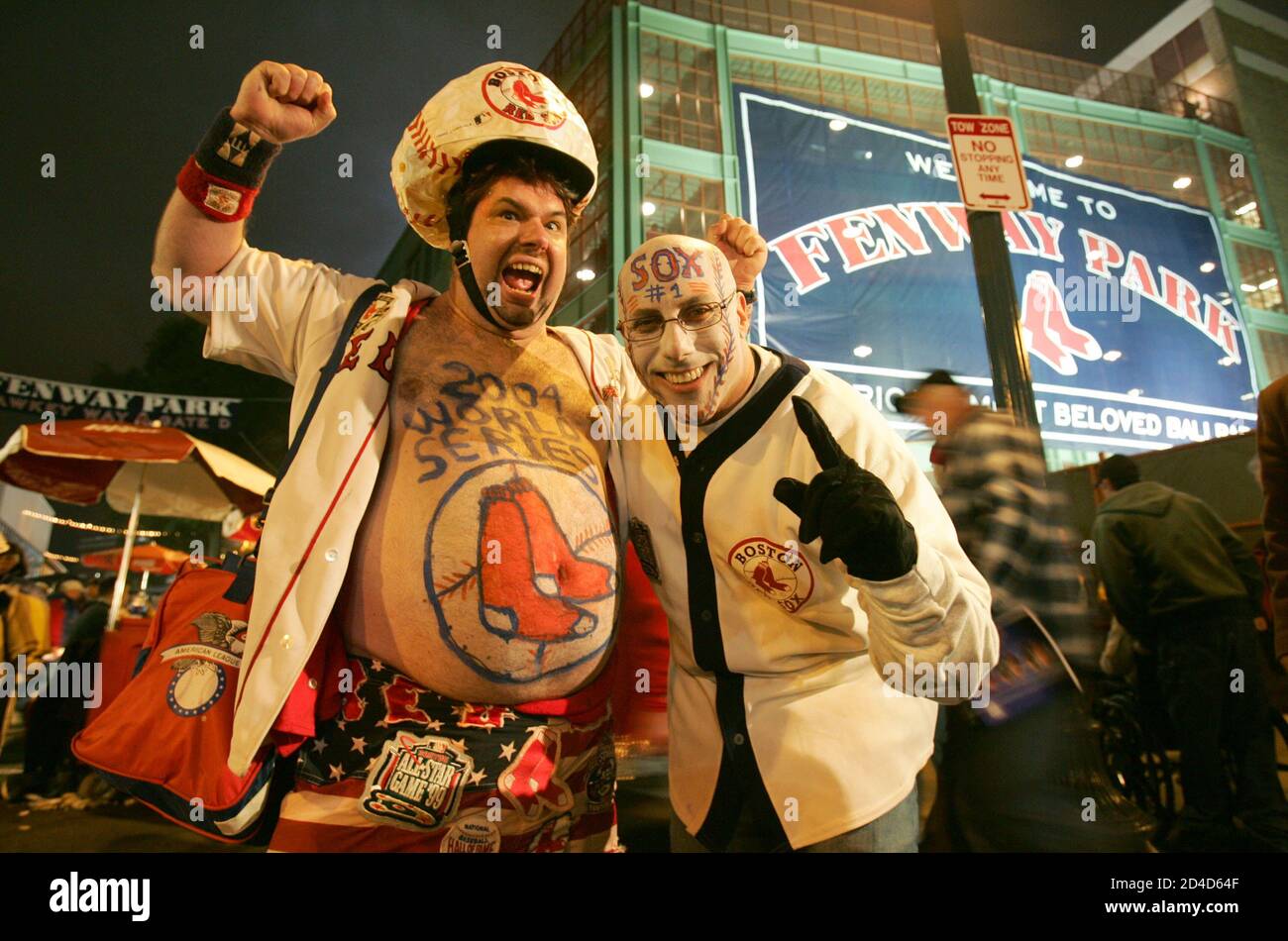 Boston Red Sox fans Mike Schuster (L) of Foxboro, Massachusetts and Rob  Ekno of Los Angeles, California pose at Fenway Park before Game 1 of the World  Series between the Red Sox