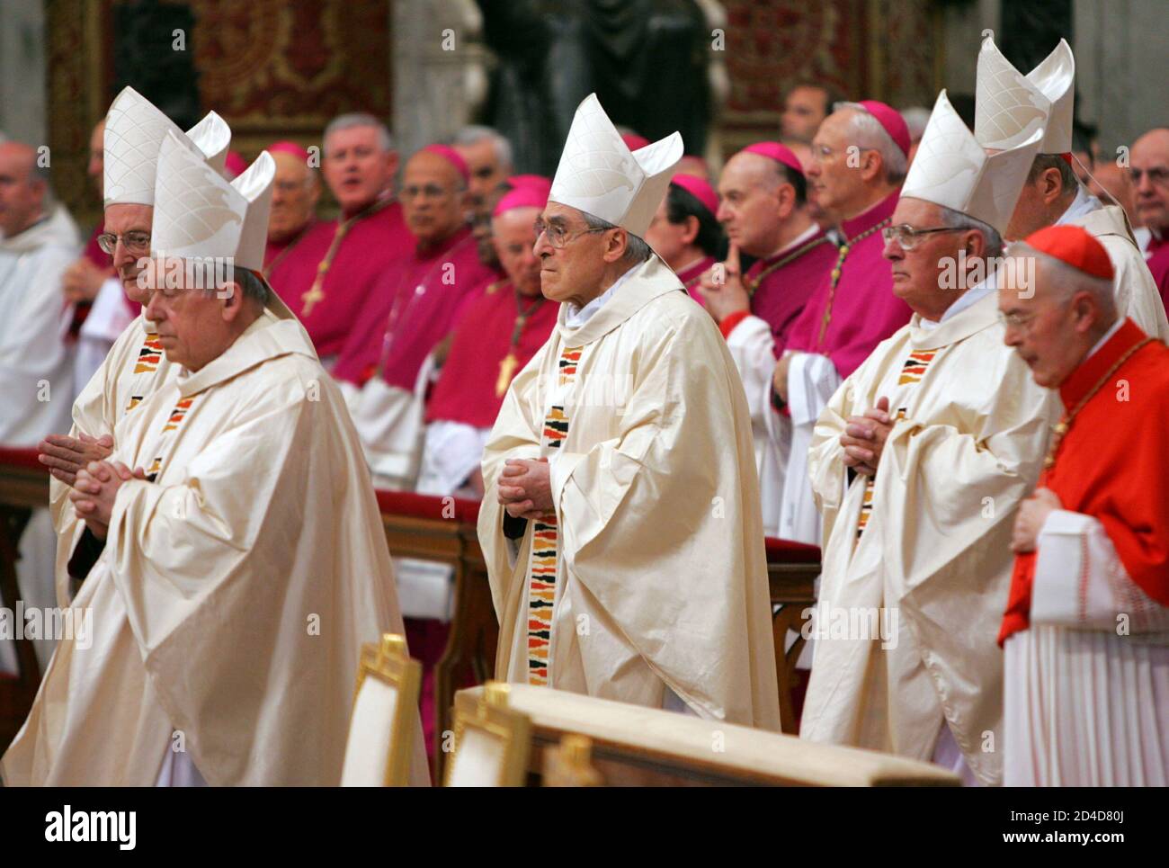 French Cardinal Jean-Marie Lustiger (C) attends a Mass, [presided over by  Chilean Cardinal Jorge Arturo Medina Estevez], in the Vatican's St. Peter's  Basilica April 16, 2005. [Smoke signals above the Sistine Chapel,