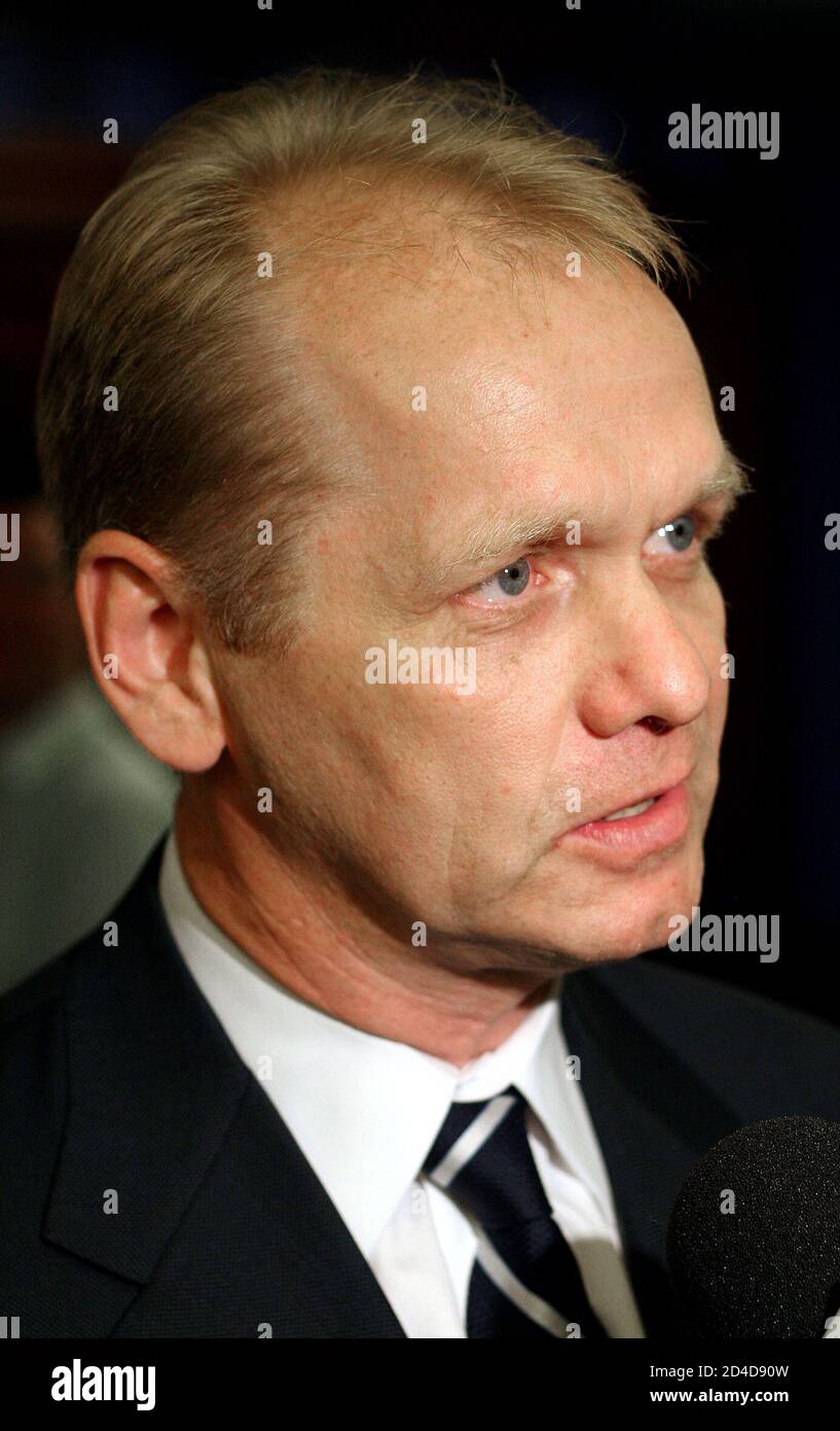 General Manager of the Buffalo Sabres Regier speaks to journalists during a news conference in New York July 22, 2005. The National Hockey League board of governors have unanimously approved