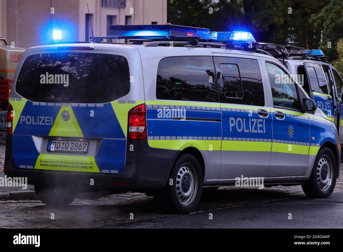 Dresden, Germany. 08th Oct, 2020. Two police vehicles with flashing