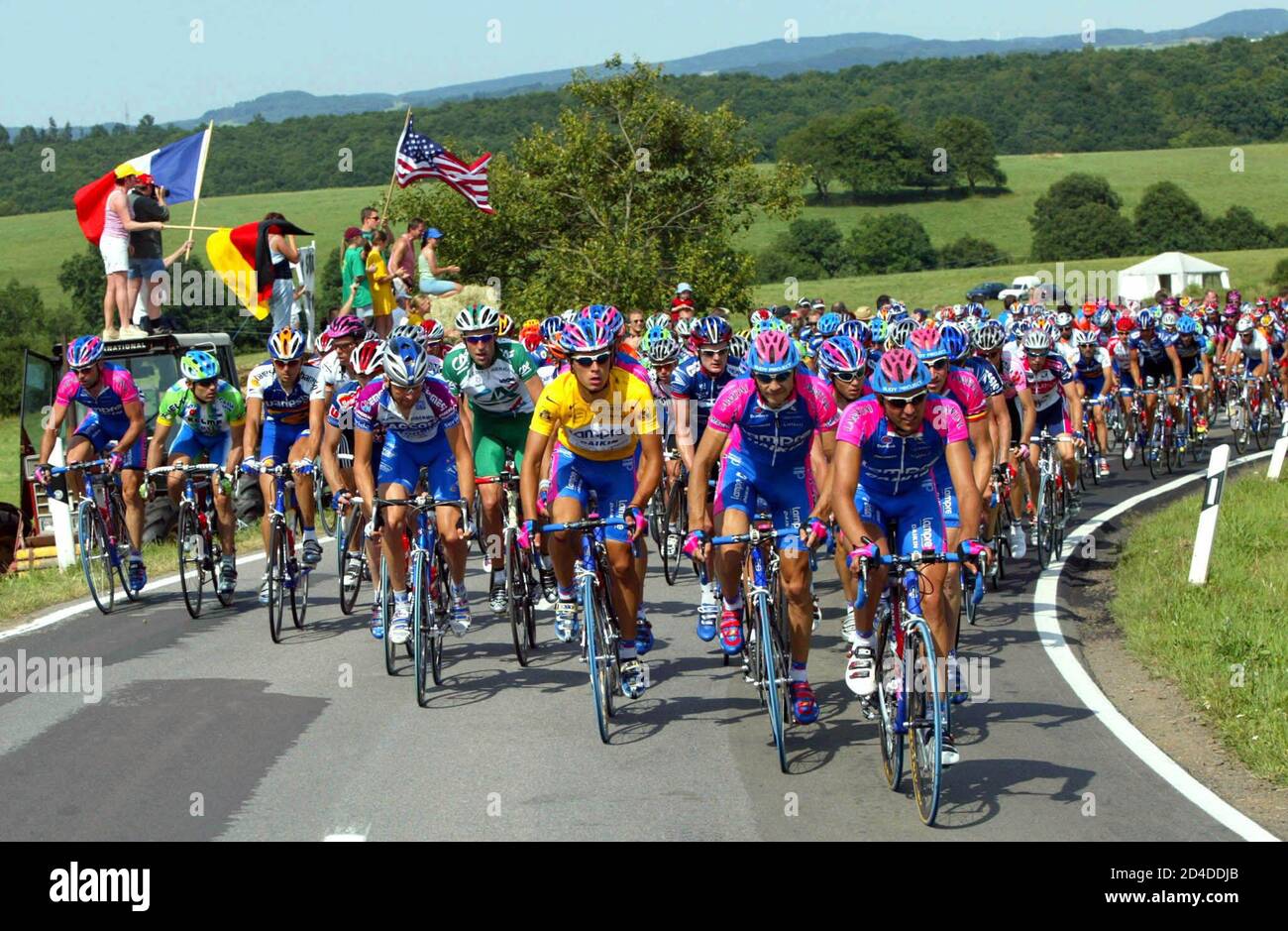 Lampre team riders lead the pack through the German countryside during  the 181km second stage of  the 89th Tour de France cycling race from [Luxembourg city] to Saarbrucken in Germany July 8, 2002. [Mapei team rider Oscar Freire of Spain won the stage in a sprint and  Lampre team rider Rubens Bertoglati of Switzerland retains the yellow leader jersey.] Stock Photo