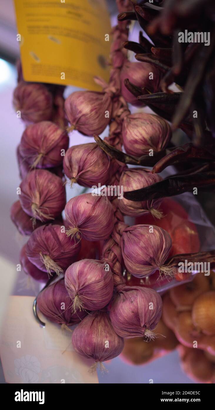 hanging garlic in the marketplace Stock Photo Alamy