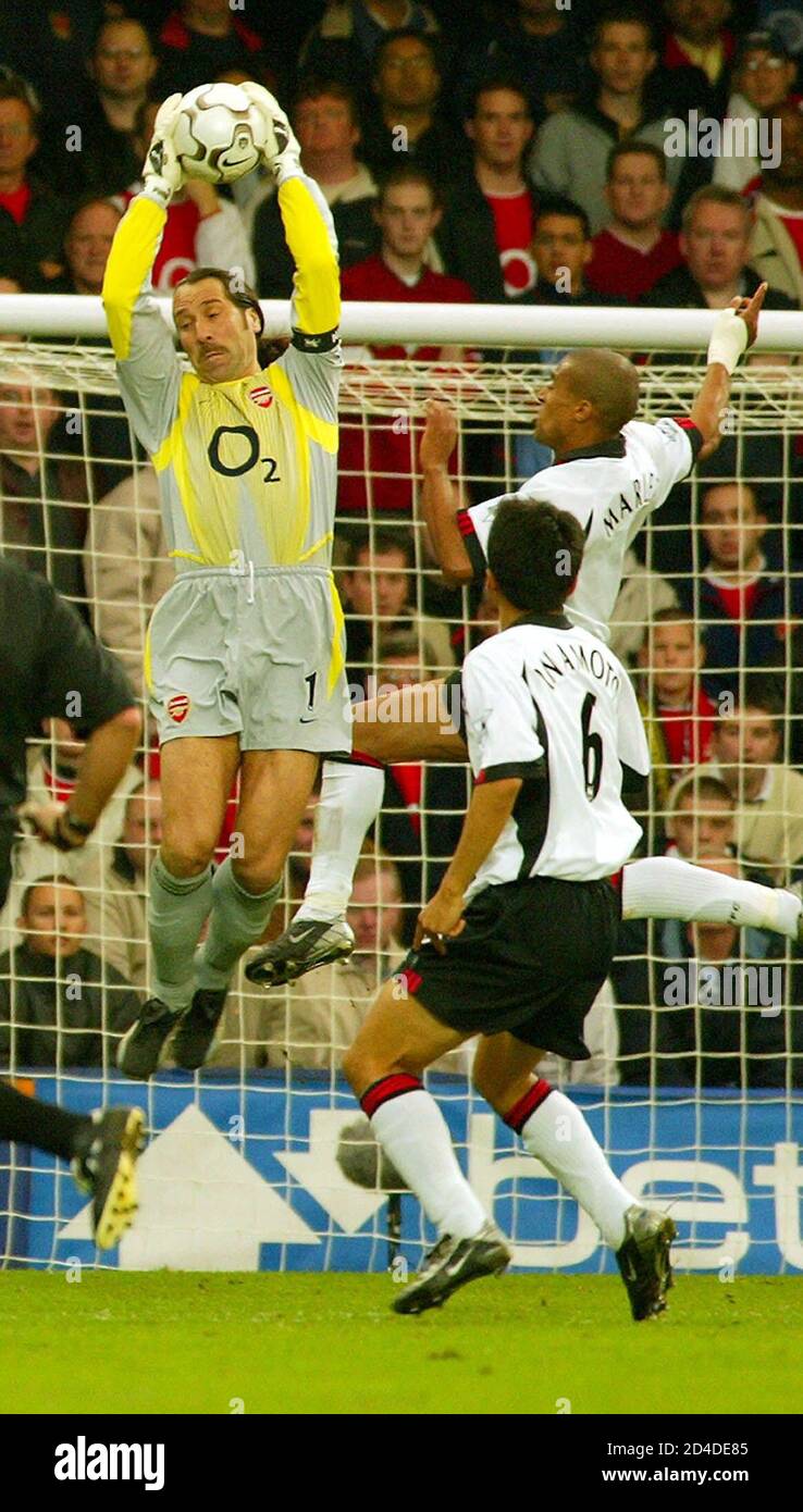 Arsenal S David Seaman L Saves The Ball From An Effort On Goal By Fulham S Japanese Midfielder Junichi Inamoto R Watched By Fulham S French Striker Steve Marlet C In Their English Premier League