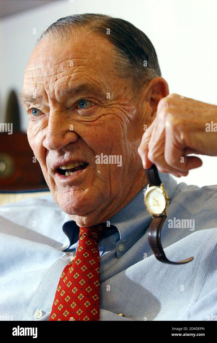 Vanguard group founder John Bogle, holds his fourteen dollar wristwatch  during an interview at his office on the Vanguard campus, near Valley  Forge, Pennsylvania, January 16, 2003. The wristwatch, a constant on