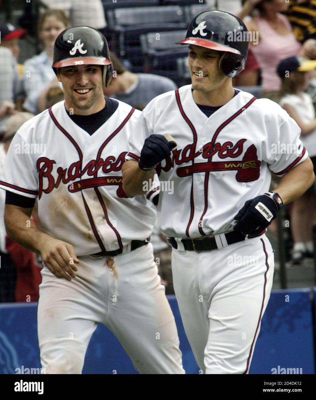 Nick Green of the Atlanta Braves (R) is congratulated by teammate Mark  DeRosa after a three-run home run off of Montreal Expos pitcher Livan  Hernandez, in the seventh inning of their game