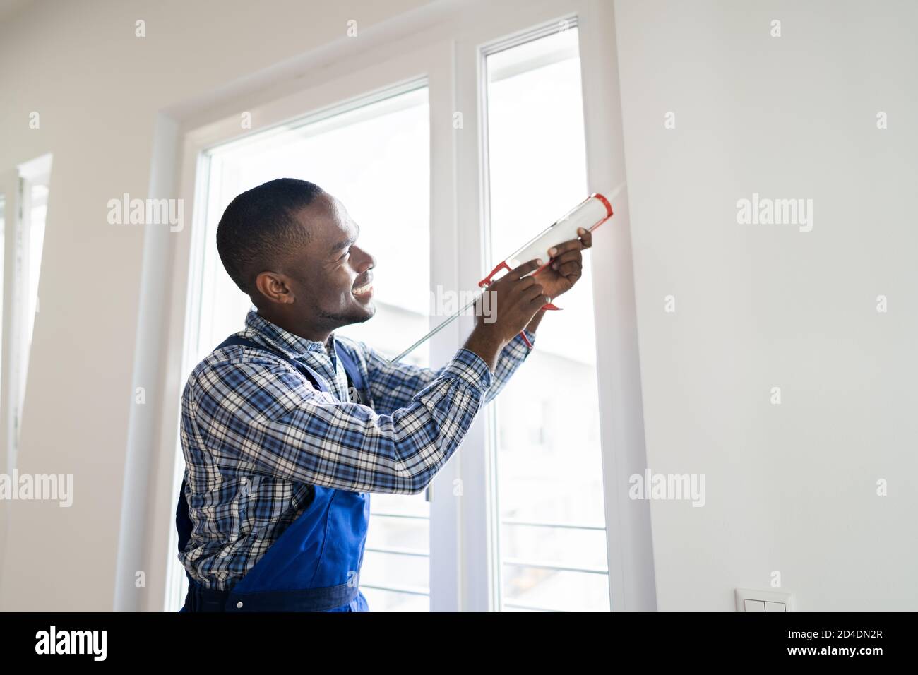 Caulk Sealant Application. Silicone Window Seal And Waterproofing Stock