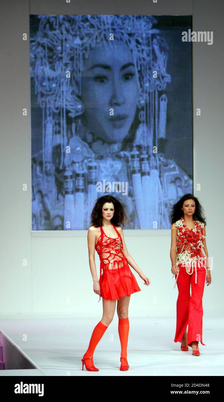 Models present a creation by Hong Kong designer Peter Lau with title 'Opera' during the Hong Kong Fashion Week for Fall/Winter 2005 in Hong Kong January 19, 2005. The Fashion Week will be held from January 18-21. Stock Photo