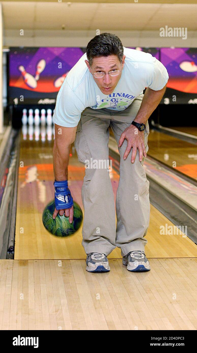 Ashrita Furman lines up a shot before bowling backwards during his attempt  to break the world record at a bowling alley in Queens, New York on May 19,  2005. Furman broke the