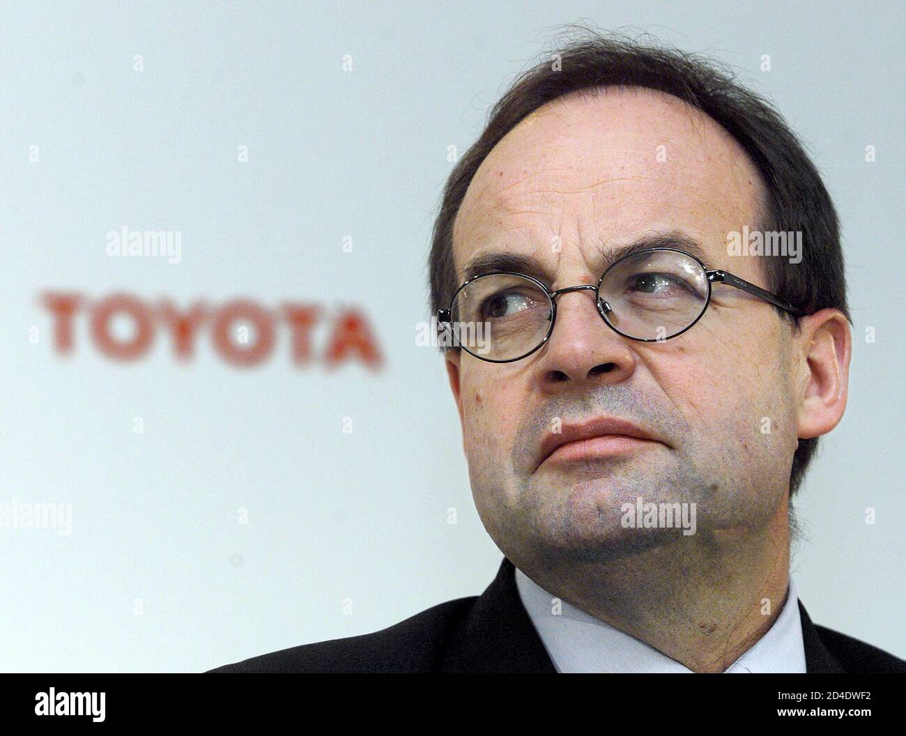 Jean-Martin Folz, chief executive officer of French car maker PSA Peugeot  Citroen listens to Fujio Cho, President of Japan's top car maker Toyota  during a joint news conference in Brussels July 12,