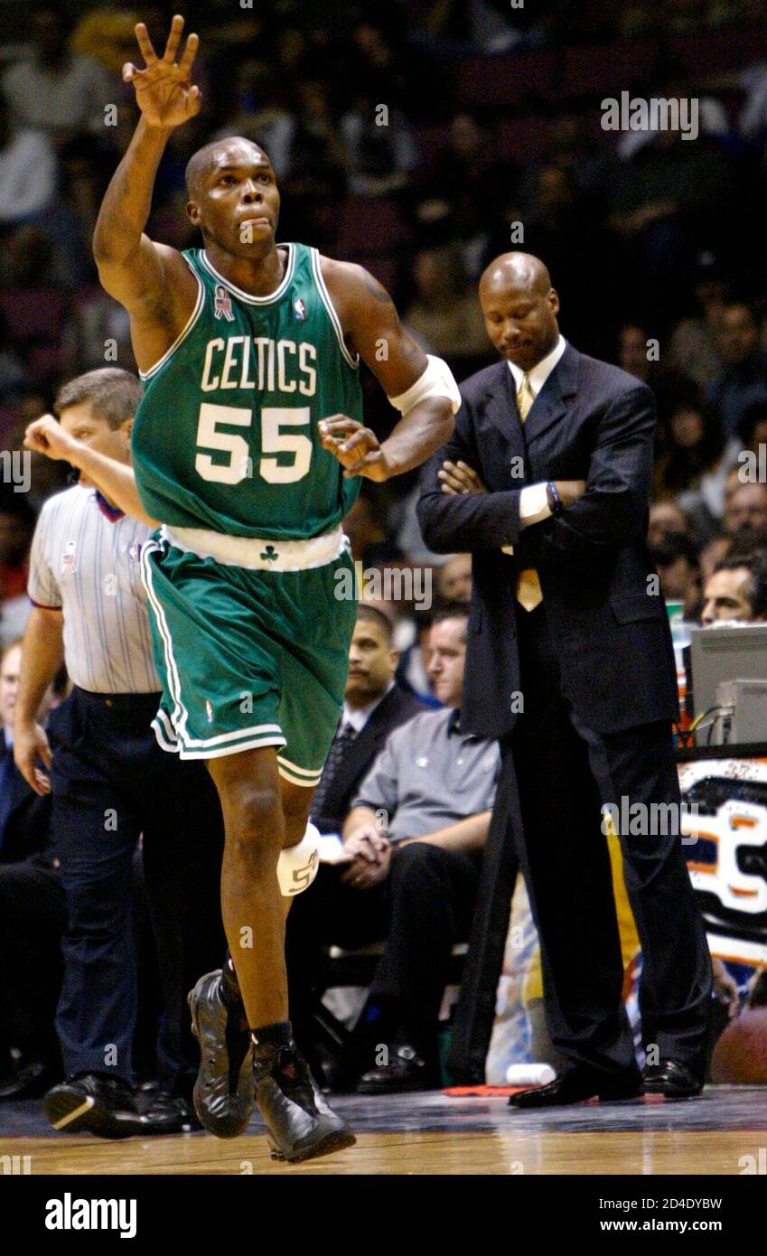 Boston Celtics Forward Eric Williams Celebrates His Three Point Basket In Front Of New Jersey Nets Head Coach Byron Scott R Late In The Fourth Quarter Of Game 2 Of The Nba Eastern