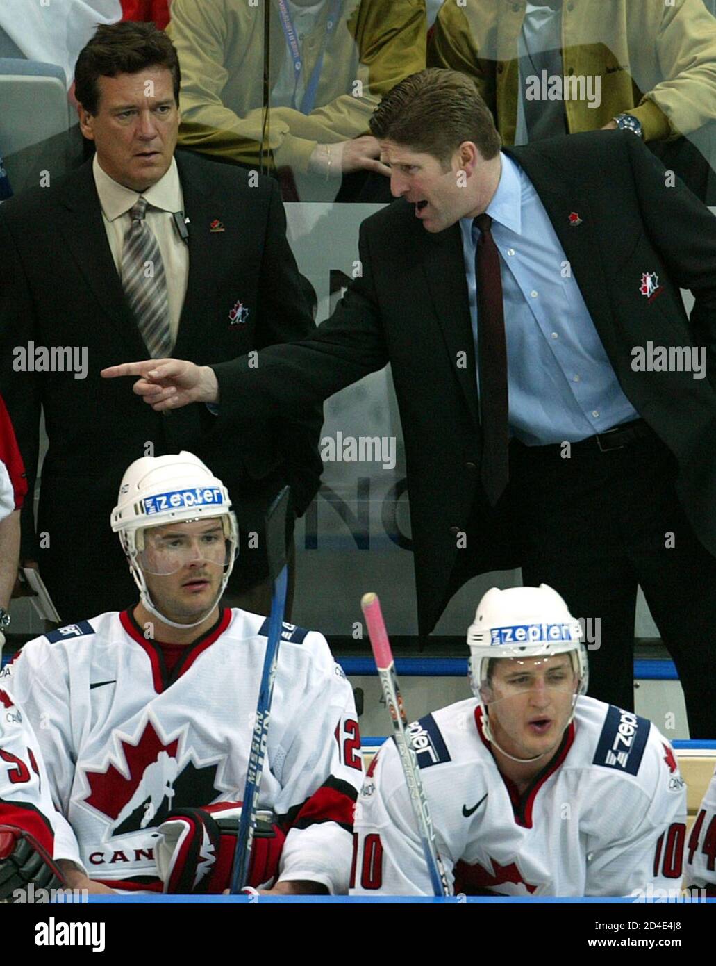 NEW CANADIAN HEAD COACH BABCOACK DIRECTS HIS TEAM ON THE BENCH DURING THEIR  PRELIMINARY ROUND MATCH AGAINST AUSTRIA AT WORLD ICE HOCKEY CHAMPIONSHIP P.  New Canadian head coach Michael Babcoack (top R)