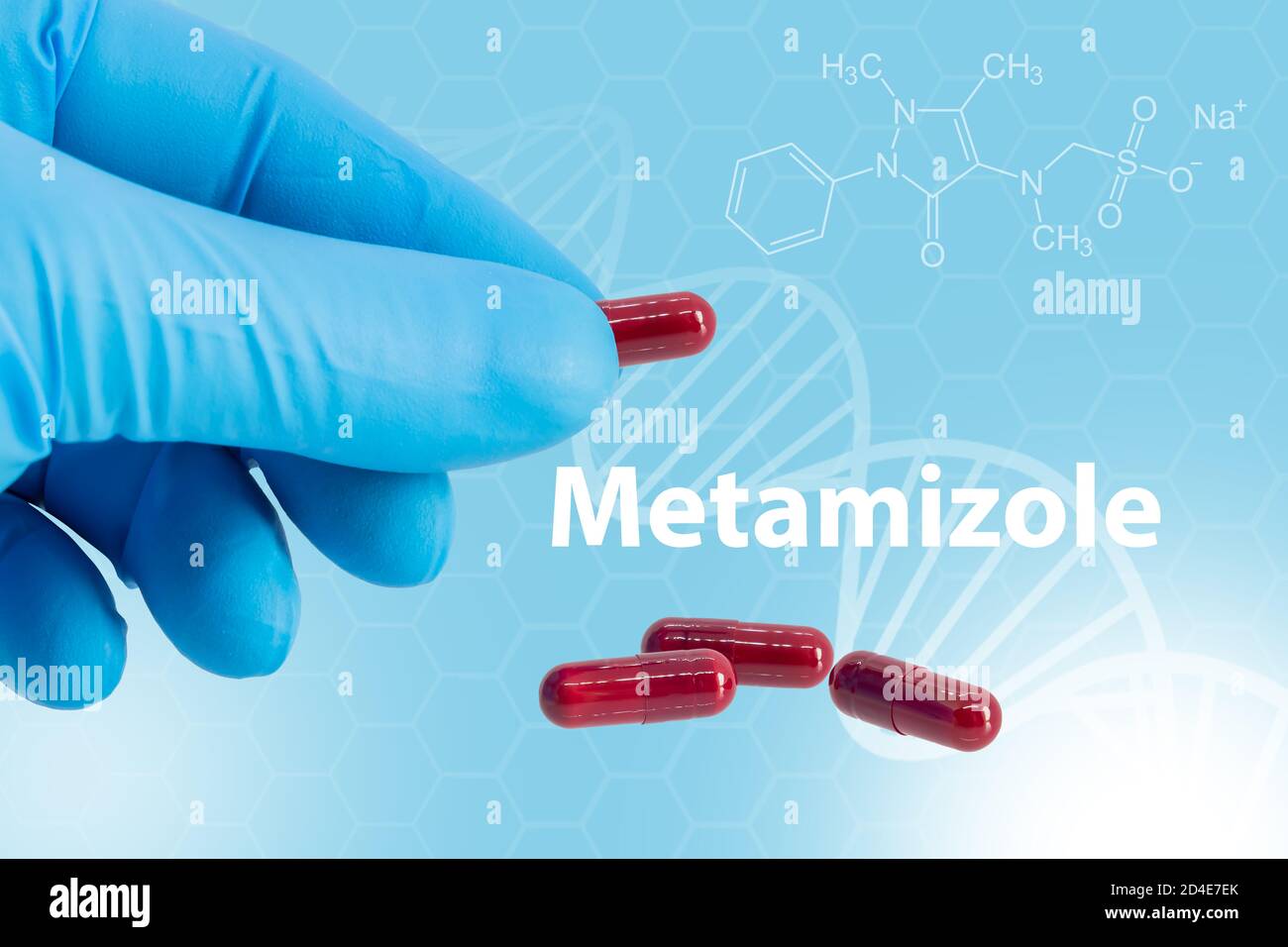 Hand with blue latex glove holds a capsule of metamizole over a background with its chemical composition. is a painkiller, spasm reliever, and fever r Stock Photo