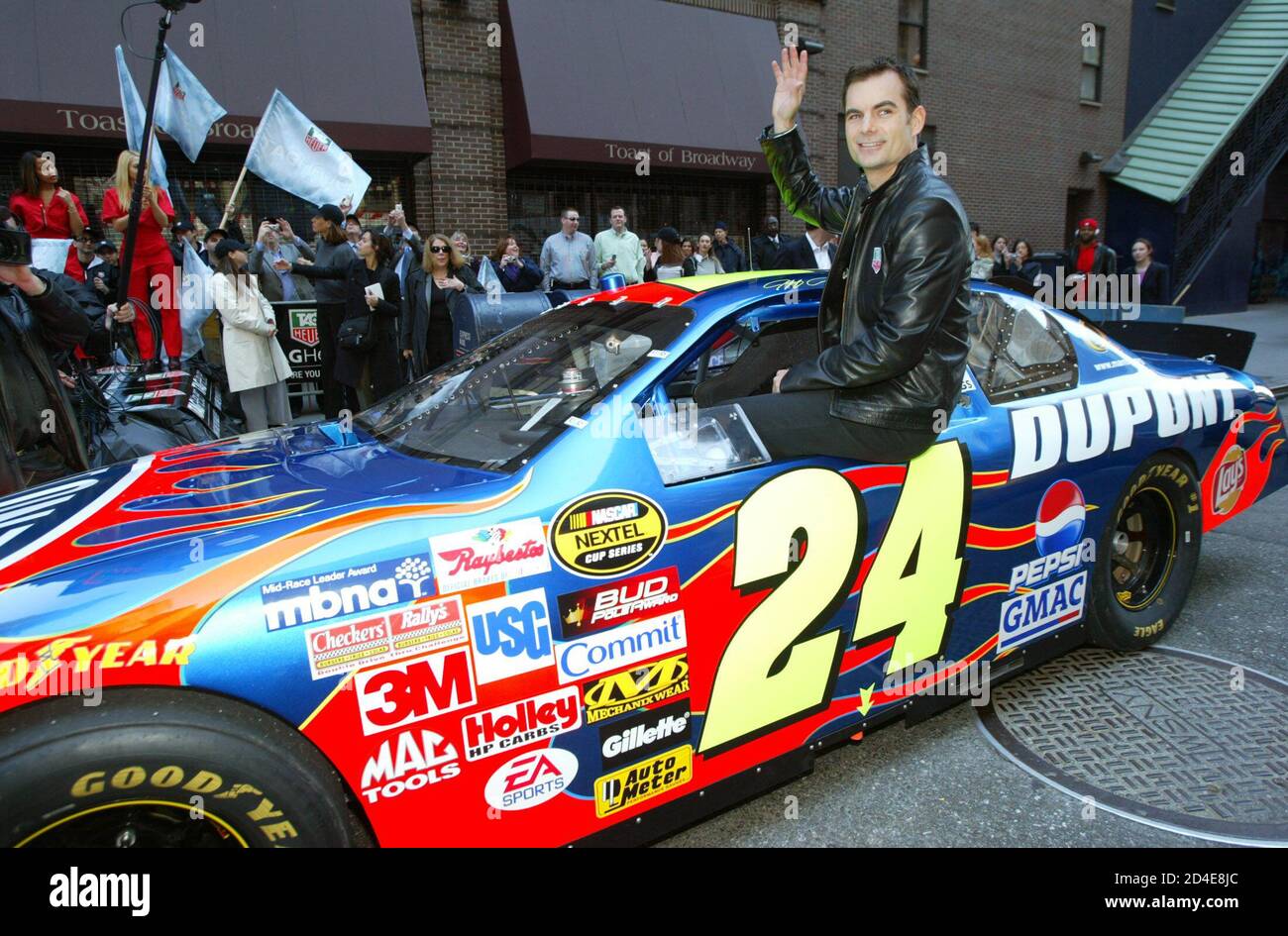 NASCAR driver Jeff Gordon waves to fans 