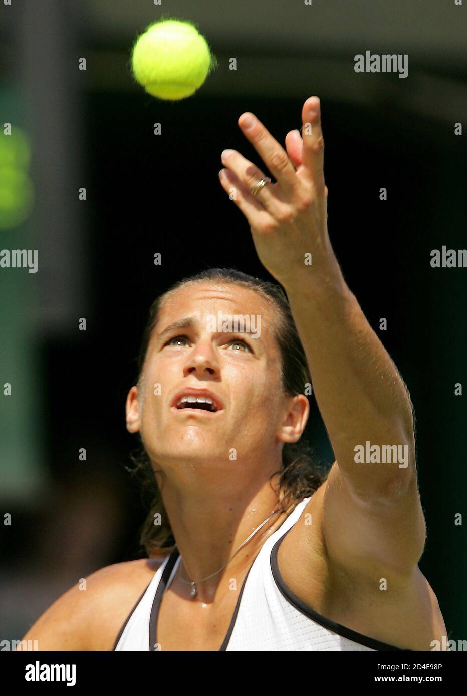 Amelie Mauresmo of France serves to Spain's Maria Sanchez Lorenzo in their second round women's singles match at the Wimbledon tennis championships in London June 22, 2005. Mauresmo won the match 6-1 6-3. REUTERS/Toby Melville  RD/dh Stock Photo