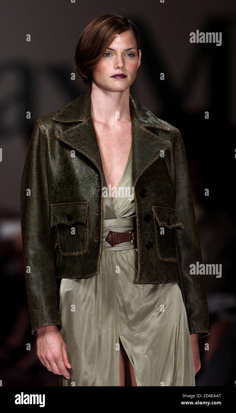 A model wears a brown leather jacket over a green dress as part of the Max  Mara Spring/Summer ready-to-wear women's collection 2001 in Milan October  3, 2000 Stock Photo - Alamy