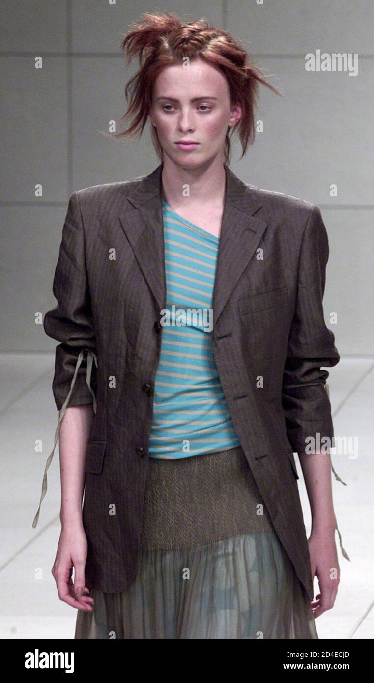 A Model For Japanese Designer Atsuro Tayama Presents This Jacket Worn Over A Striped Shirt With A Layered Dress As Part Of His Spring Summer 02 Ready To Wear Collection In Paris October 11 01