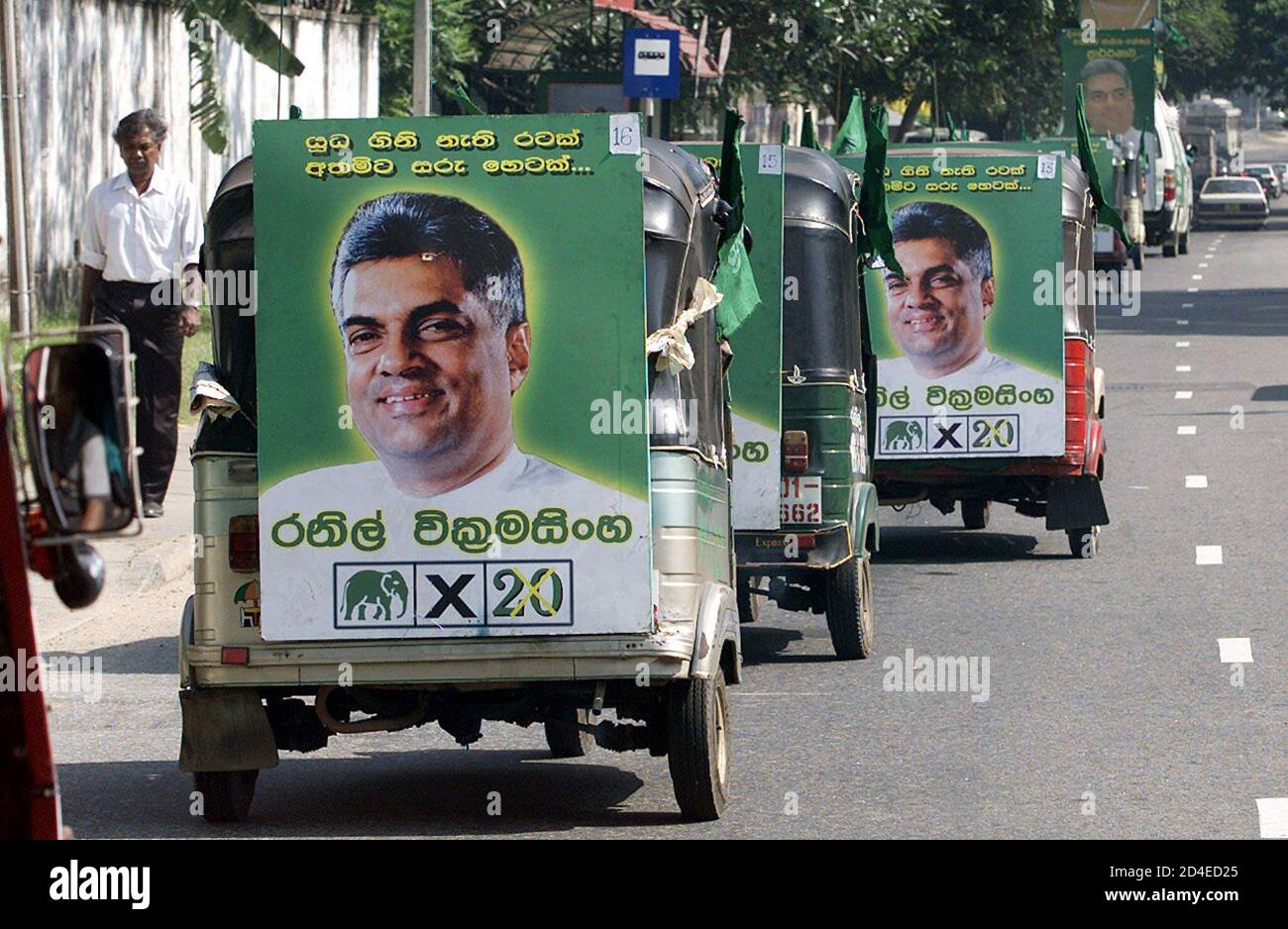 supporters-of-the-opposition-united-nation-party-unp-leader-ranil-wickramasinghe-form-a-procession-as-they-display-his-portrait-on-the-last-day-of-campaigning-for-the-december-5-election-in-the-sri-lankan-capital-colombo-on-december-2-2001-the-european-union-on-friday-accused-sri-lankas-two-main-parties-of-being-behind-a-surge-in-election-violence-and-warned-that-unless-the-situation-improved-next-weeks-parliamentary-vote-would-be-tainted-reutersanuruddha-lokuhapuarachchi-alcp-2D4ED25.jpg
