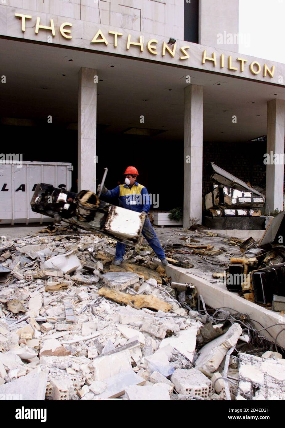 A construction worker clears unwanted objects in front of the main entrance of Athens' Hilton hotel December 5, 2001. The Hilton hotel closed last week for major renovation in time for the Athens 2004 Olympiad and is expected to reopen on December 2002. Athens' other landmark hotel, the Grande Bretagne, has also shut down for renovation. REUTERS/Yiorgos Karahalis REUTERS  YK Stock Photo