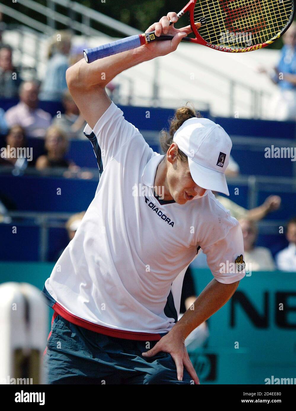 Gaston Gaudio of Argentina throws his racket on the court during his  semi-final match against Albert Costa of Spain at the Energis tennis open  in Amersfoort, the Netherlands on July 20,2002. REUTERS/Michael