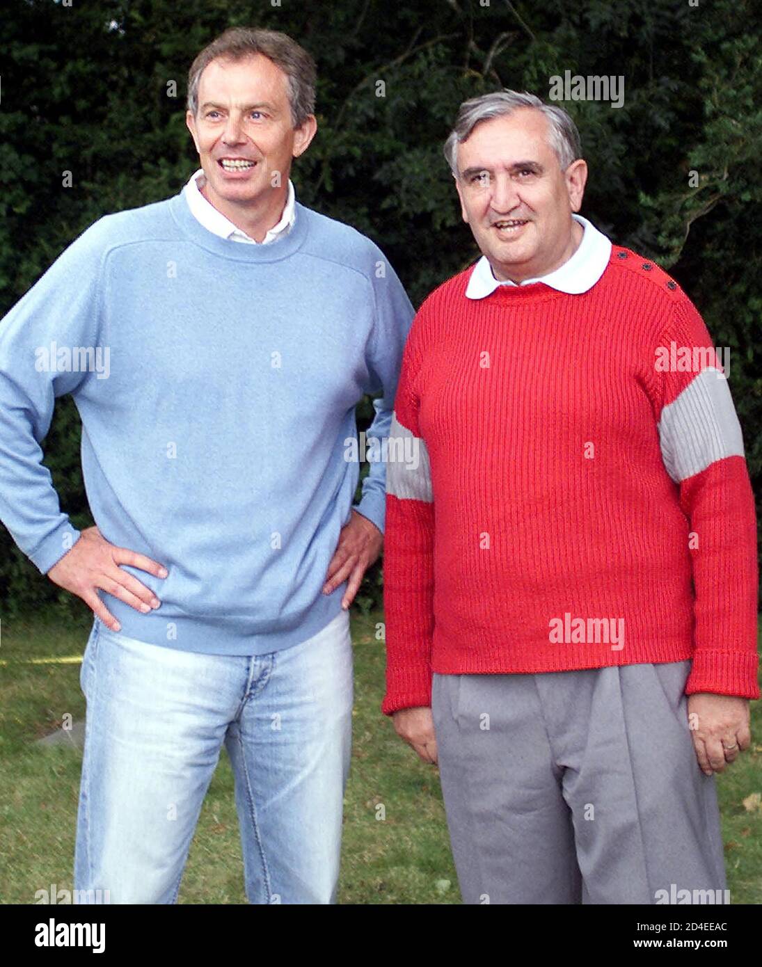 British prime Minister Tony Blair (L) poses with French prime Minister Jean-Pierre Raffarin after a private meeting in the castle of 'Lagrezette' in Caillac, southwestern France, August 12,2002. Blair is currently on holiday in the area. Stock Photo