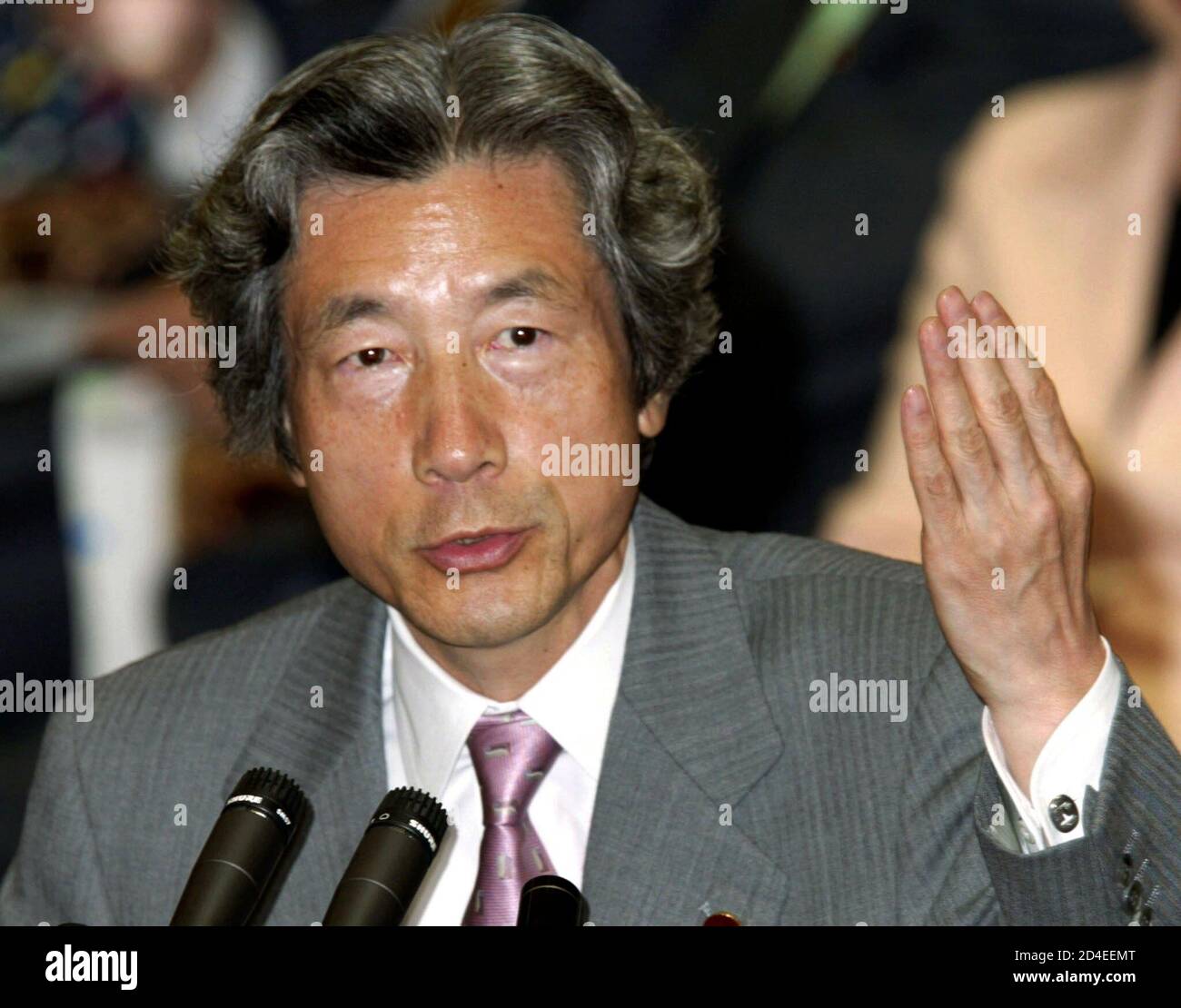 Japan's Prime Minister Junichiro Koizumi speaks at a Lower House budget committee session of parliament in Tokyo October 24, 2002. Risking a revolt in his own party, Koizumi stood firm in support of his besieged banking regulators on Thursday, backed by signs the Bank of Japan would help ease the pain of tough reforms. REUTERS/Toshiyuki Aizawa  TA/CP Stock Photo