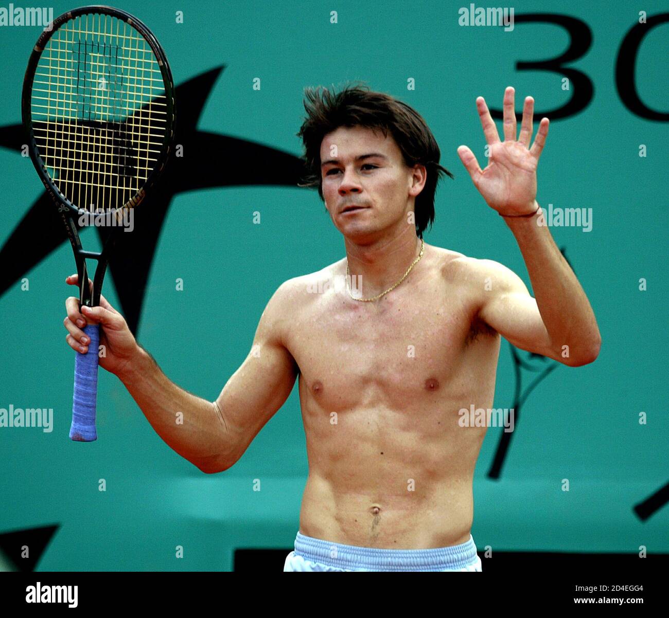 Guillermo Coria Of Argentina Walks With No Shirt On The Central Court After His Racket Hits A Ball Boy During His Match Against Martin Verkerk Of The Netherlands In The Semi Final Of